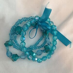 4 bracelets tied together w/ matching satin ribbon